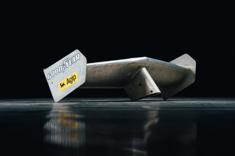 Close-up of Ferrari 312 T2 rear wing with Goodyear and Agip sponsor logos. / Dettaglio dell'ala posteriore Ferrari 312 T2 con loghi sponsor Goodyear e Agip.