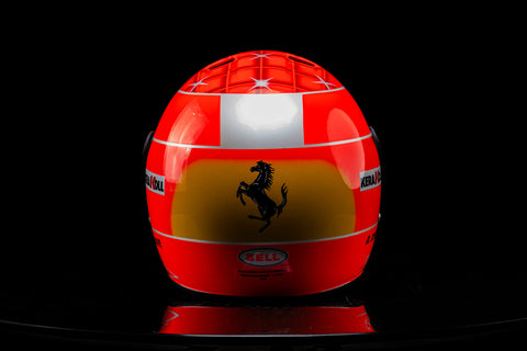 Schumacher Ferrari helmet replica with yellow accents. / Replica casco Ferrari di Schumacher con dettagli gialli