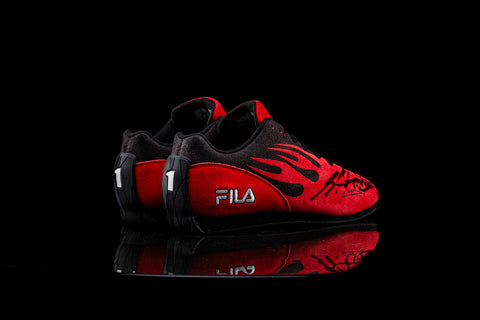 Racing FILA shoes signed by Schumacher. / Scarpe FILA da corsa, autografate da Schumacher