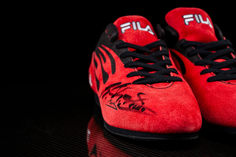 Official FILA racing shoes with Schumacher’s signature. / Scarpe da corsa ufficiali FILA con firma di Schumacher