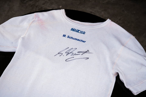 Michael Schumacher signed collector’s shirt with Sparco logo. / Maglia da collezione autografata da Michael Schumacher con logo Sparco