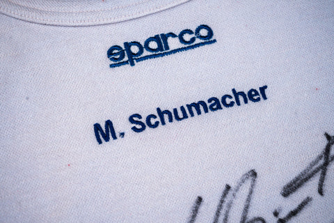 Rare Michael Schumacher signed Ferrari shirt, F1 history. / Rara maglia Ferrari autografata da Michael Schumacher, storia della F1
