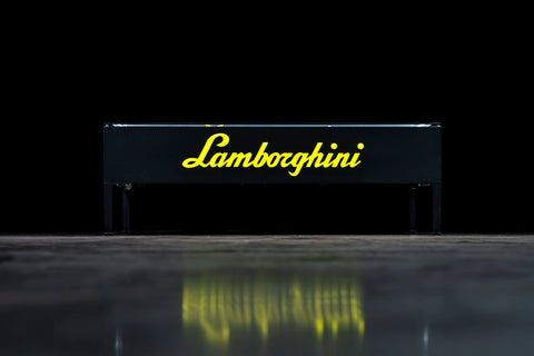 Red and yellow Lamborghini models in table. / Modellini Lamborghini rossi e gialli nel tavolo