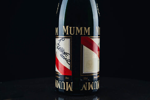 1050 - Mumm Podium Bottle Signed from Michael Schumacher