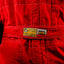 Historic Ferrari race suit from Gerhard Berger’s F1 career. / Tuta storica Ferrari da gara della carriera F1 di Gerhard Berger