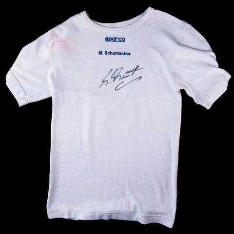Signed Michael Schumacher Ferrari shirt, 2000s team edition. / Maglia Ferrari autografata da Michael Schumacher, edizione team anni 2000